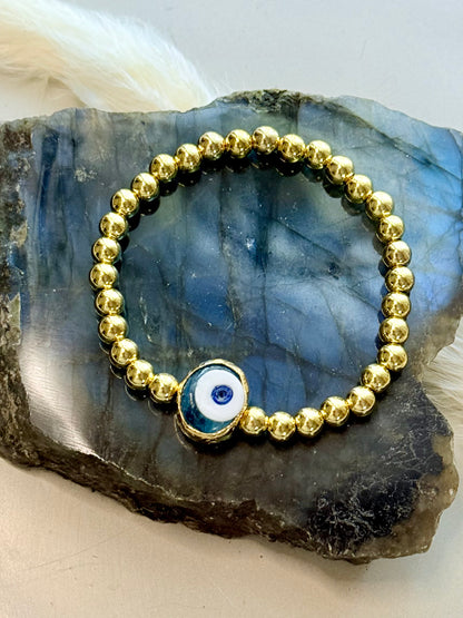 Translucent Blue Artsy Evil Eye + Gold Beaded Bracelet