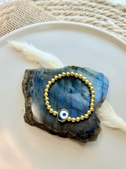 Translucent Blue Artsy Evil Eye + Gold Beaded Bracelet