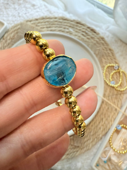 Translucent Blue Artsy Evil Eye + Gold Beaded Bracelet